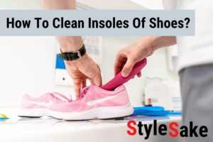 Man cleaning insoles of shoes